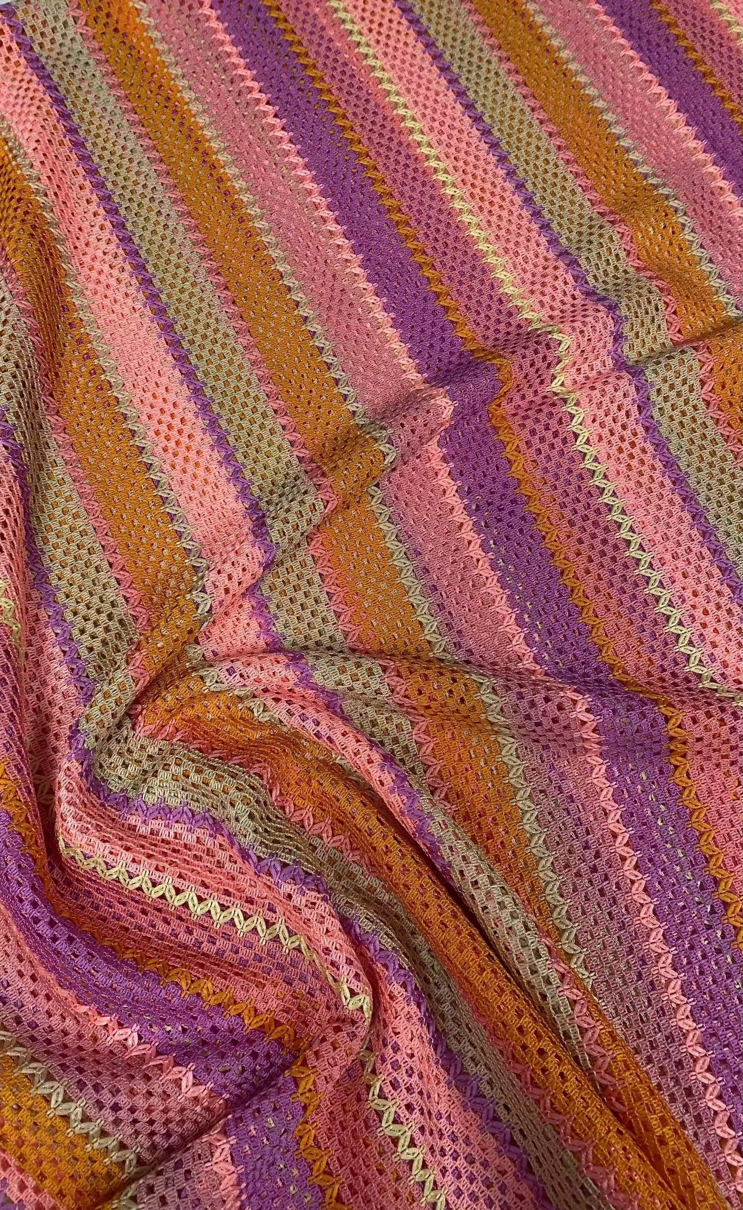 Pink striped knit mesh fabric with breathable lightweight texture for fashion and crafts