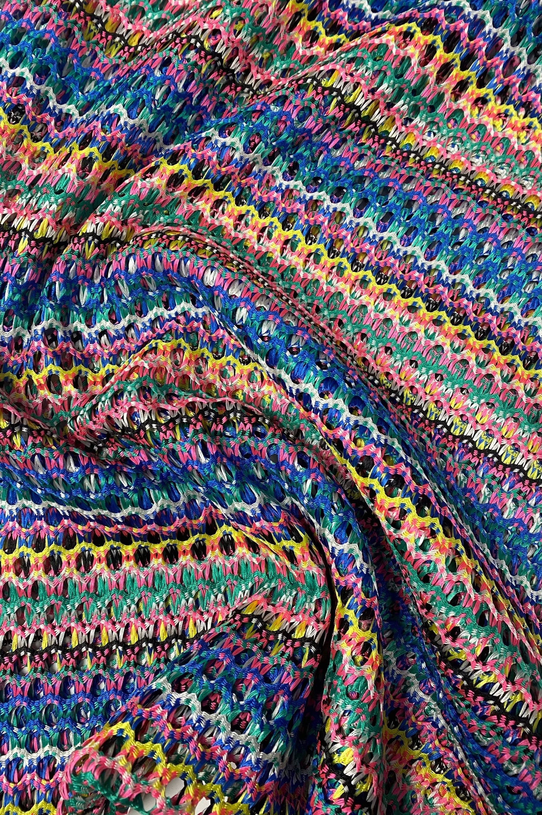 Multicolor chevron zigzag knit jersey fabric with vibrant, stretchy, soft texture for apparel and crafts