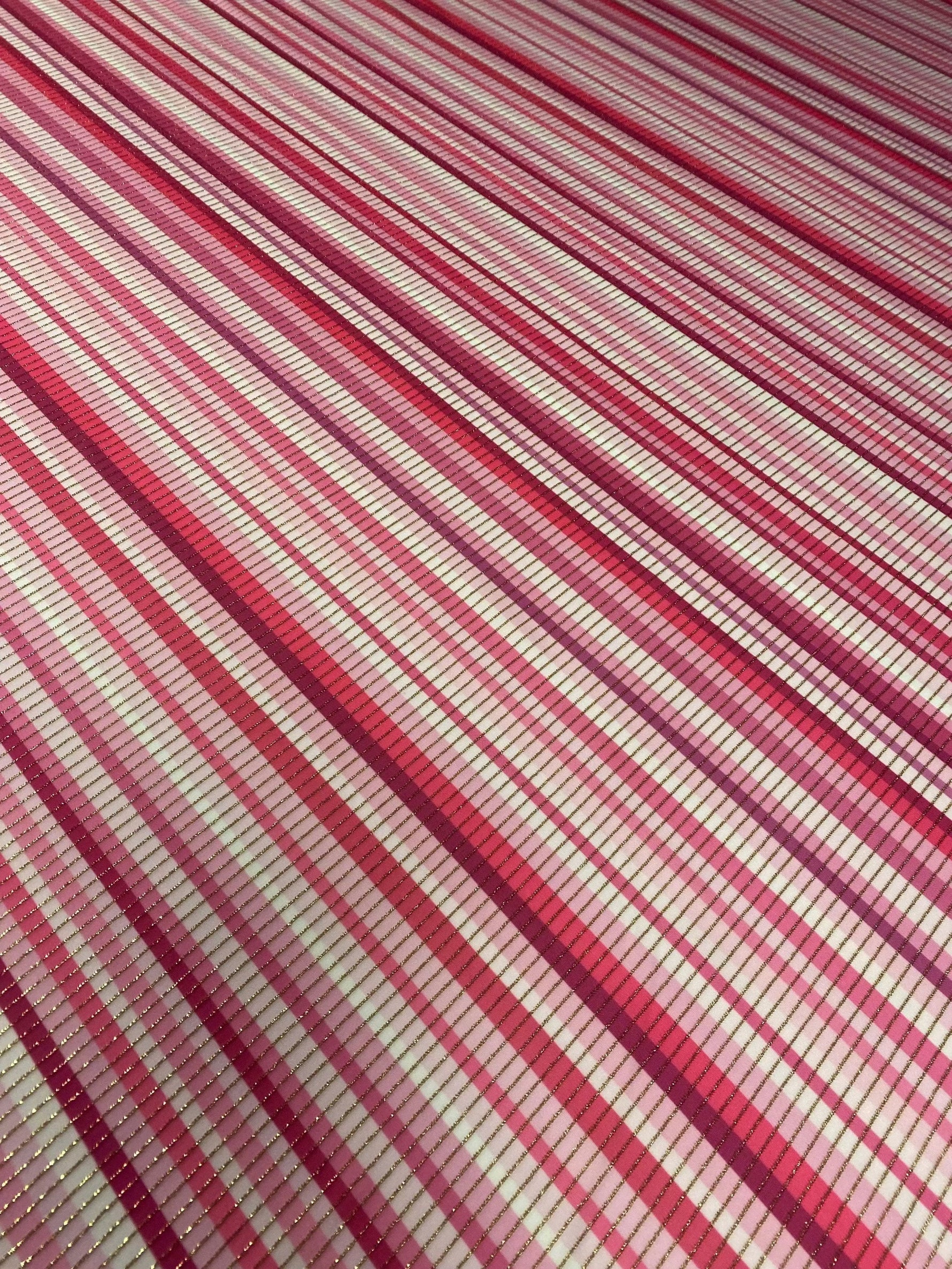 Close-up of Shimmer Fabric Ottoman with pink and white striped 4-way stretch design and shimmering finish
