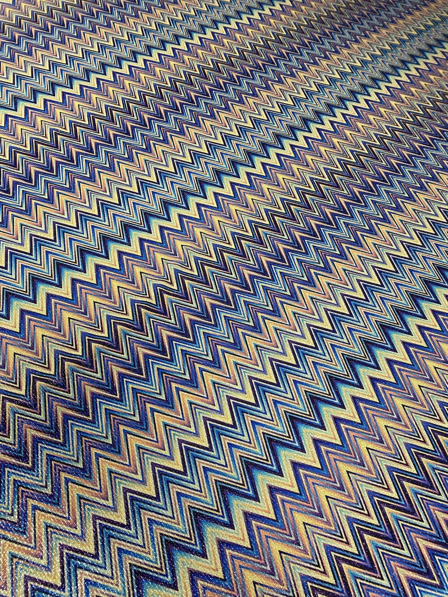 Blue zigzag fabric with shimmering gold lurex detail, polyester material, wide width for sewing projects