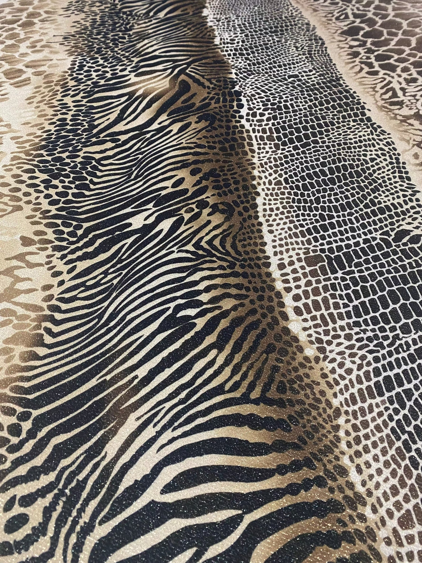 Metallic animal print Lurex fabric with gold shimmer and 4-way stretch spandex blend