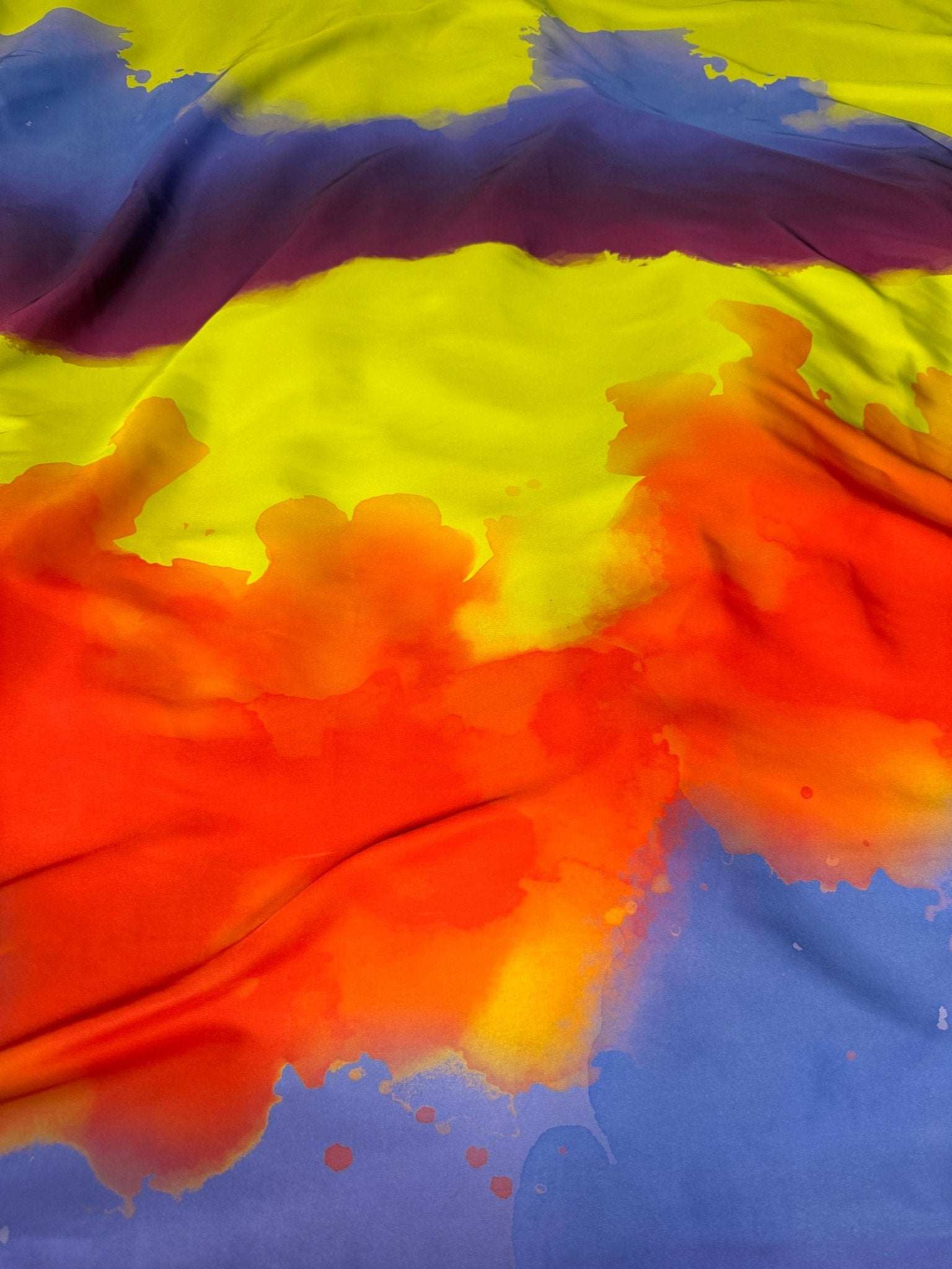 Abstract Watercolor Fabric with vibrant orange, yellow, purple, and blue artistic design and smooth texture