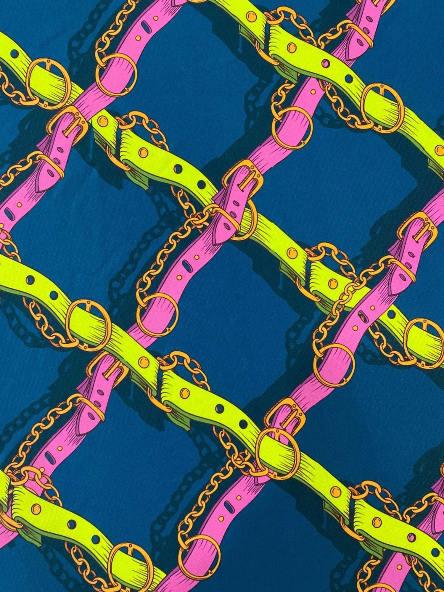 Pink and yellow chain pattern fabric with bright belts on a dark background