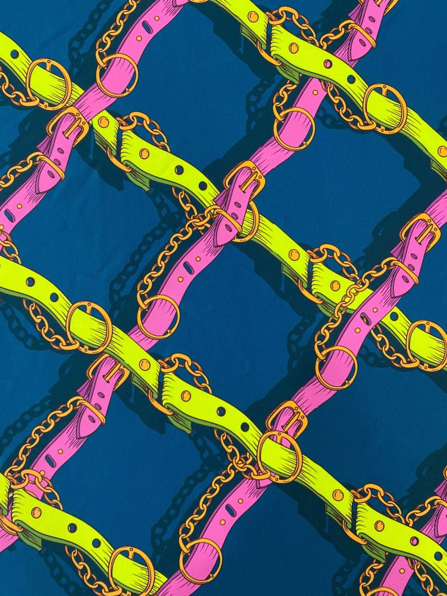 Pink and yellow chain pattern fabric with bright belts on a dark background