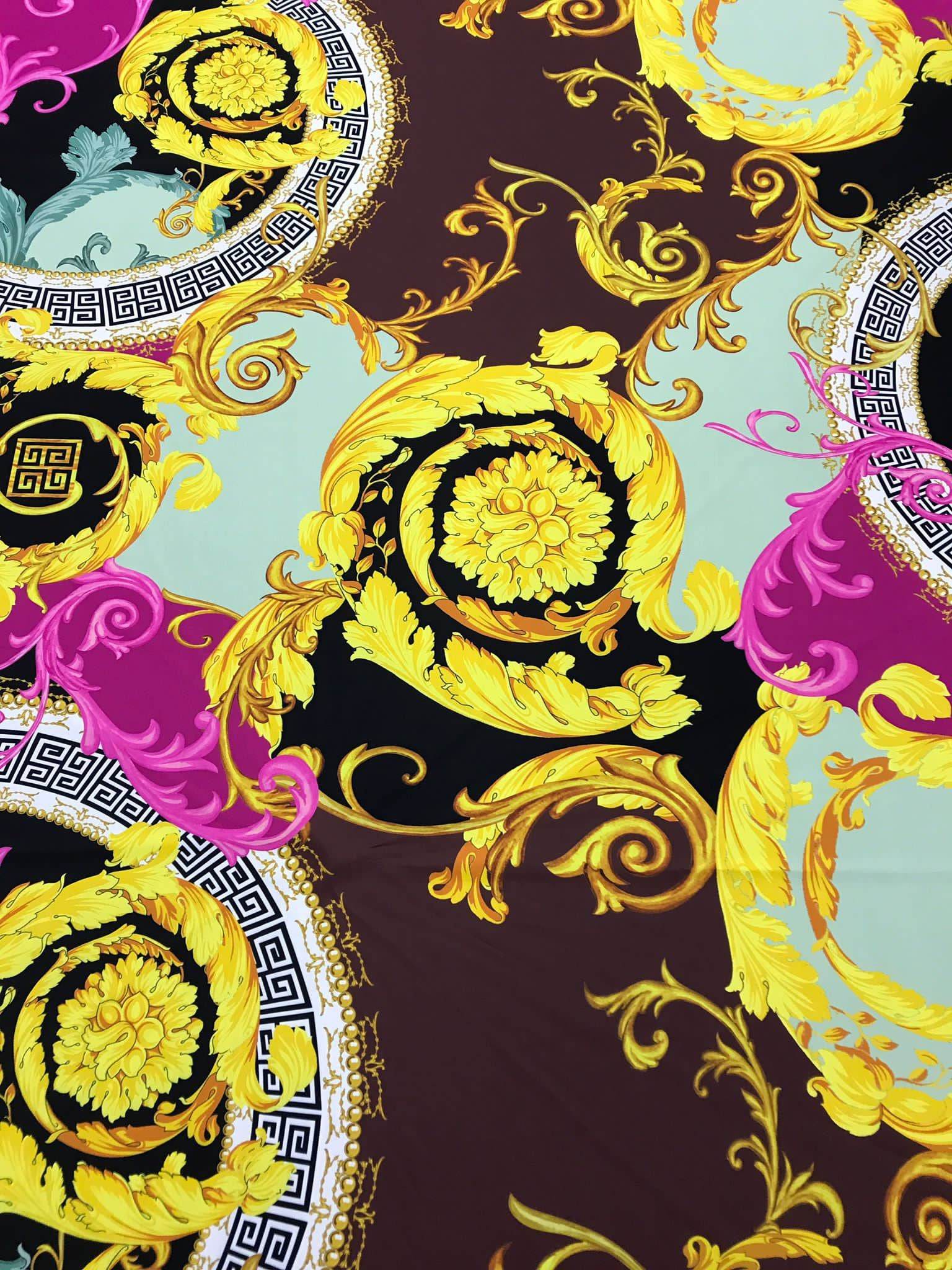 Black pink fabric with ornate Greek key print and gold floral swirls design
