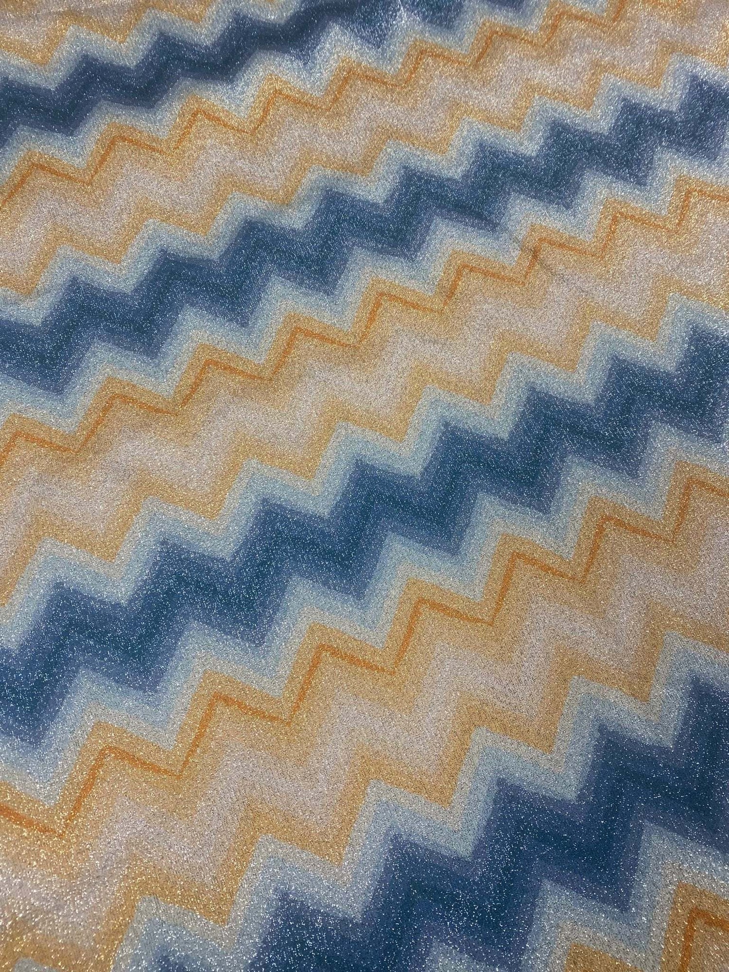 Blue and gold zigzag pattern Lurex fabric with 4-way stretch and glittery finish