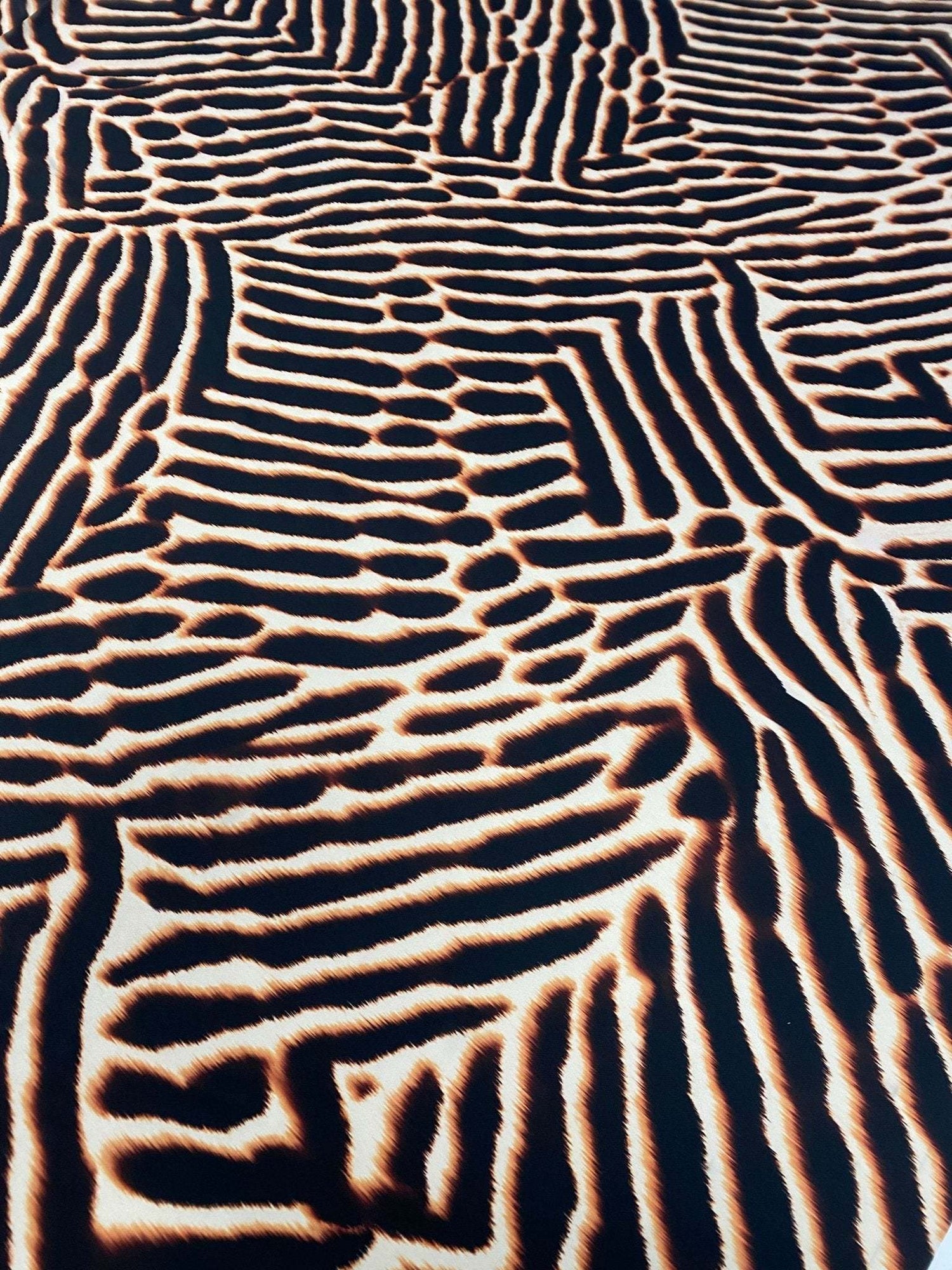 Brown and black animal print fabric with bold pattern and 150cm width for sewing projects