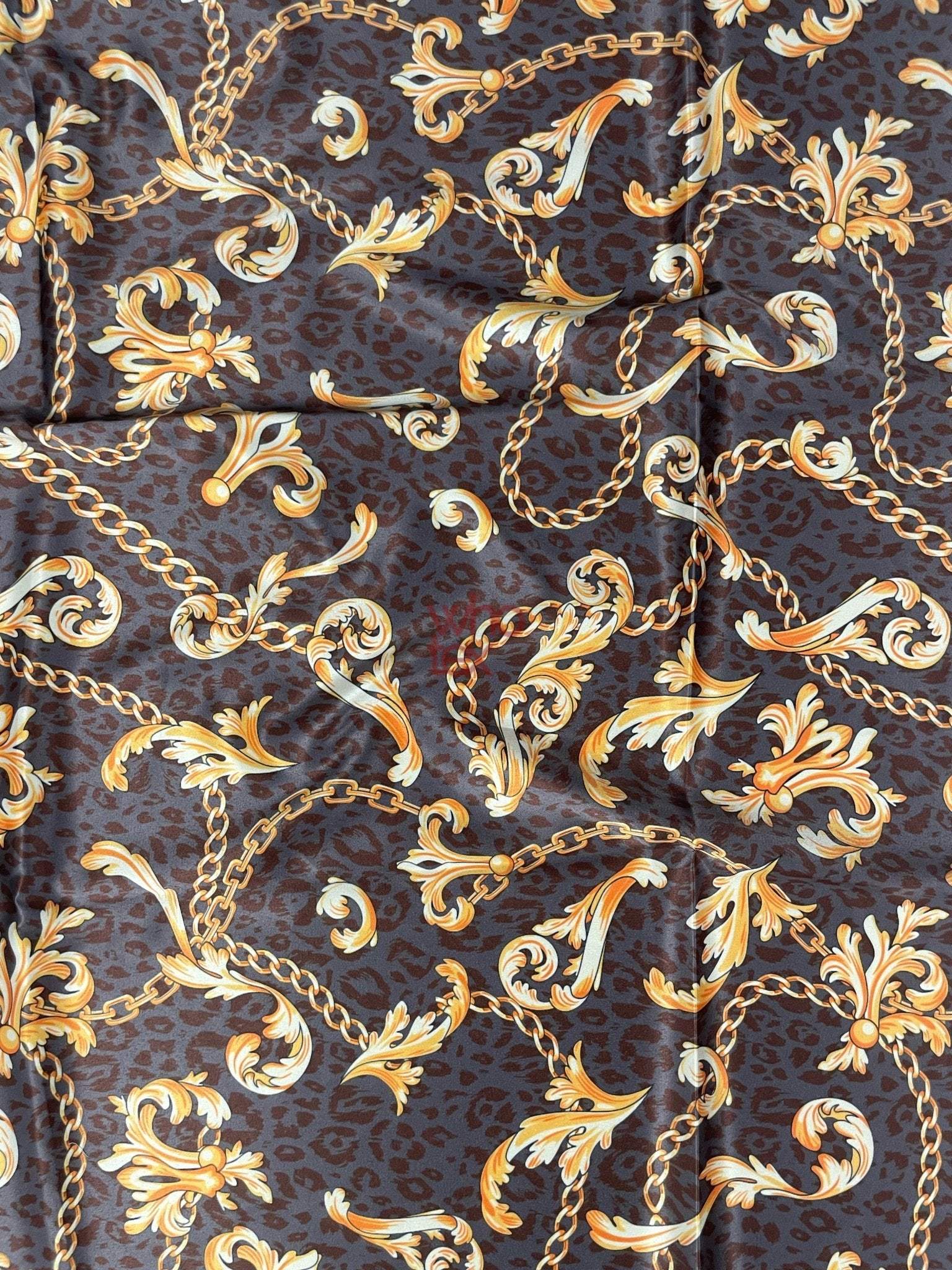 Brown leopard print fabric with gold baroque chain and flourishes pattern