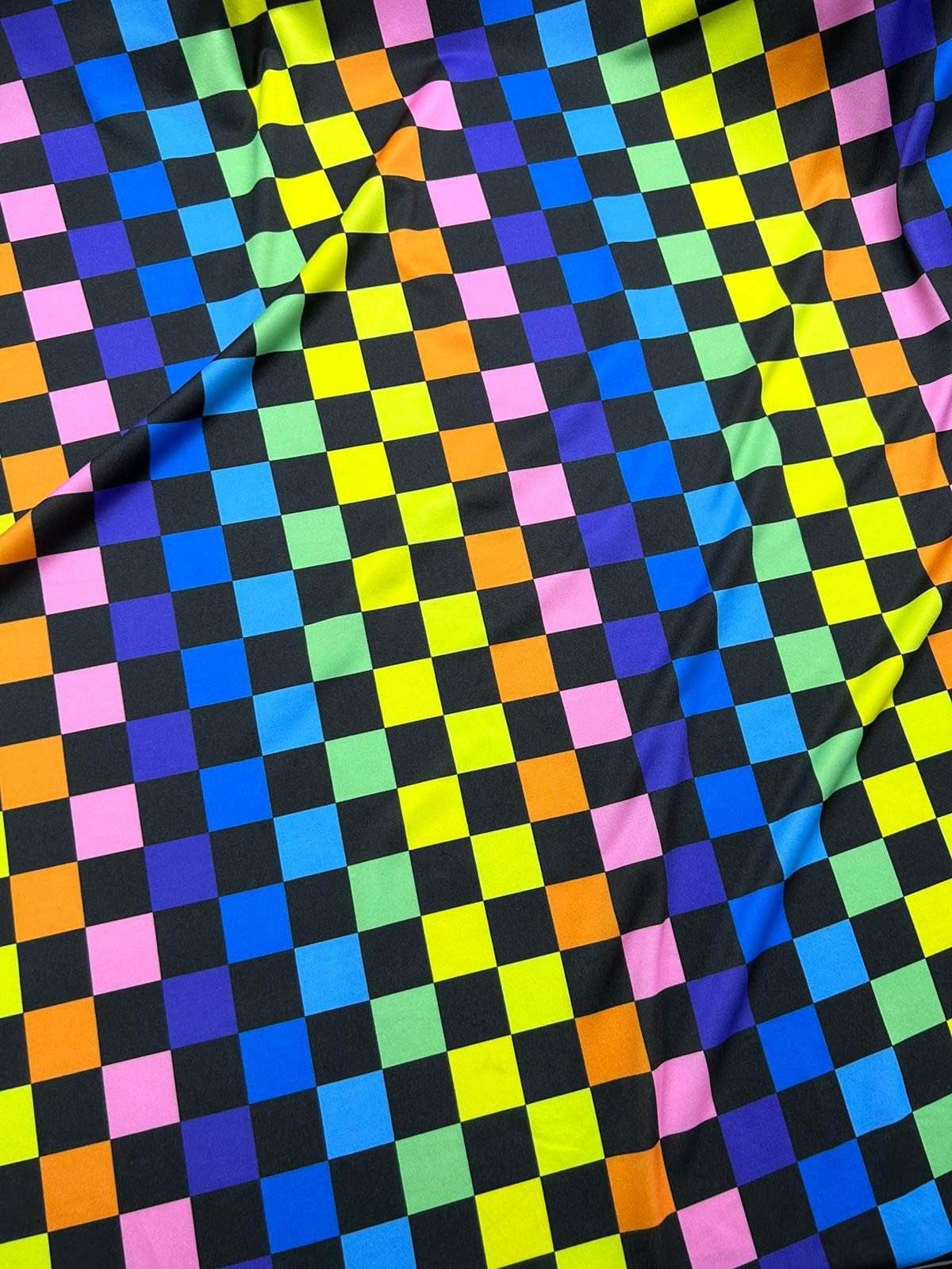 Rainbow Checkers Print Fabric with vibrant multicolor square pattern on soft textile by the yard