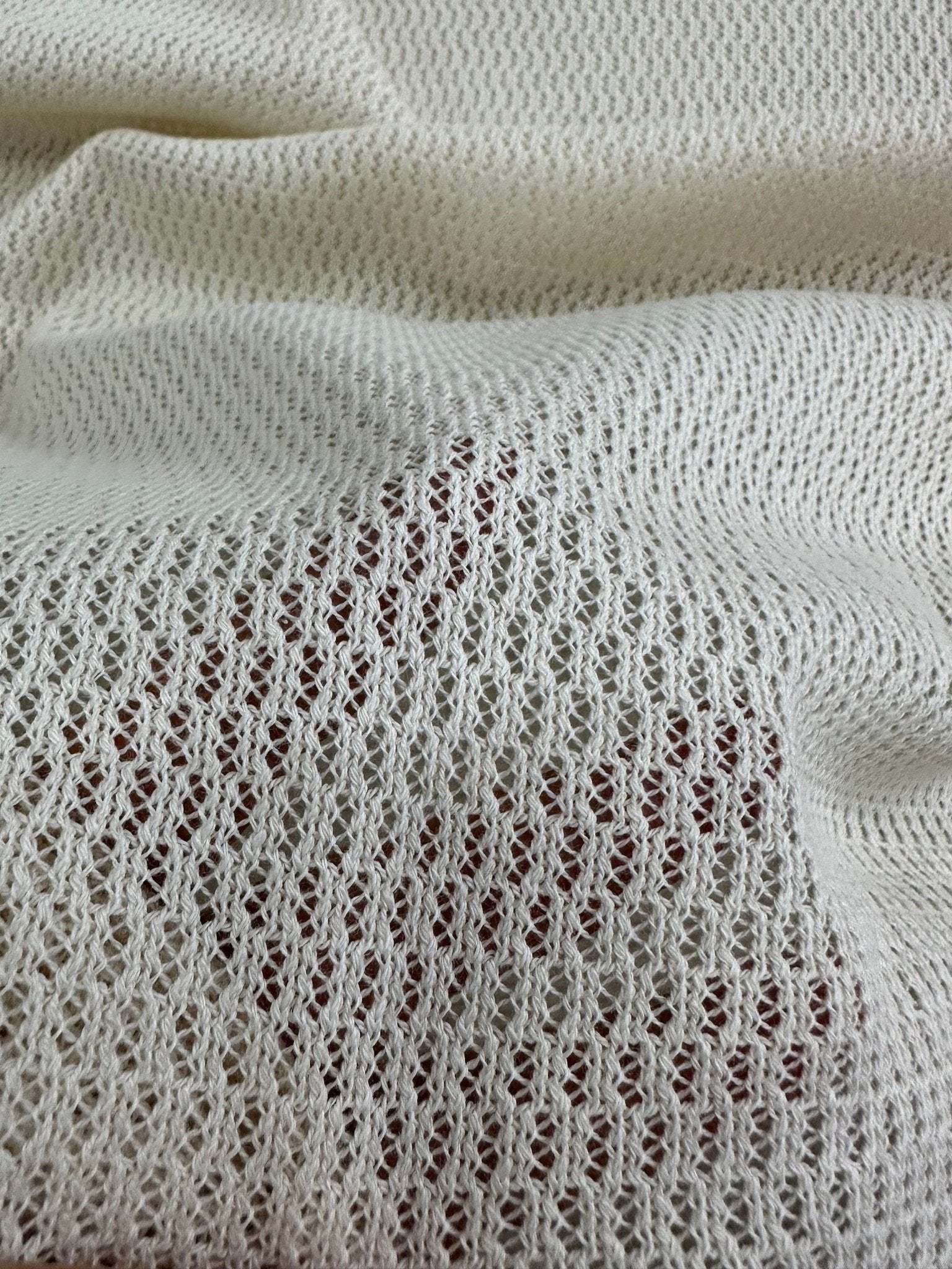 100 cotton off-white fishnet mesh fabric with open weave texture for crafting and apparel projects