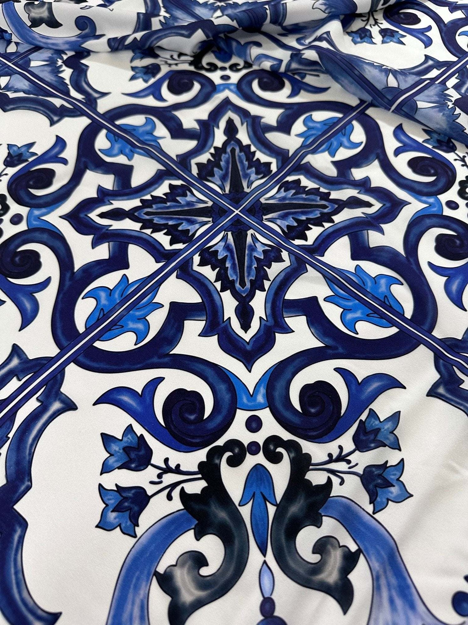 Majolica pattern blue and white swirl crepe fabric with intricate floral design