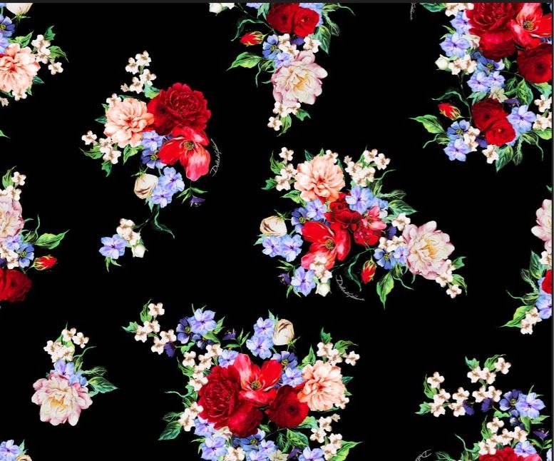 Elegant black fabric with vibrant red, pink, purple, and white floral pattern for sewing projects