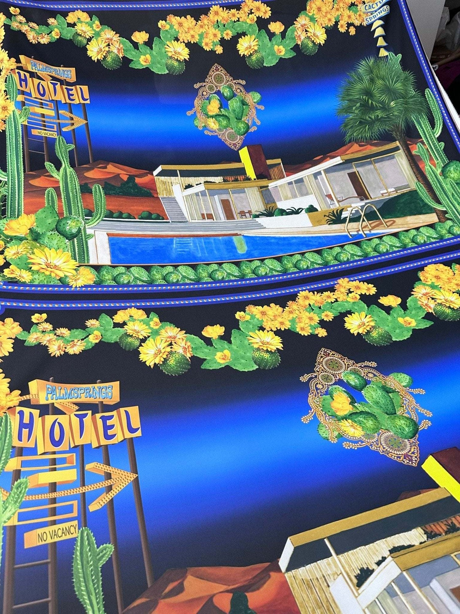 Palm Springs Retro Hotel Print Fabric with vibrant vintage motel and desert cacti design on blue background