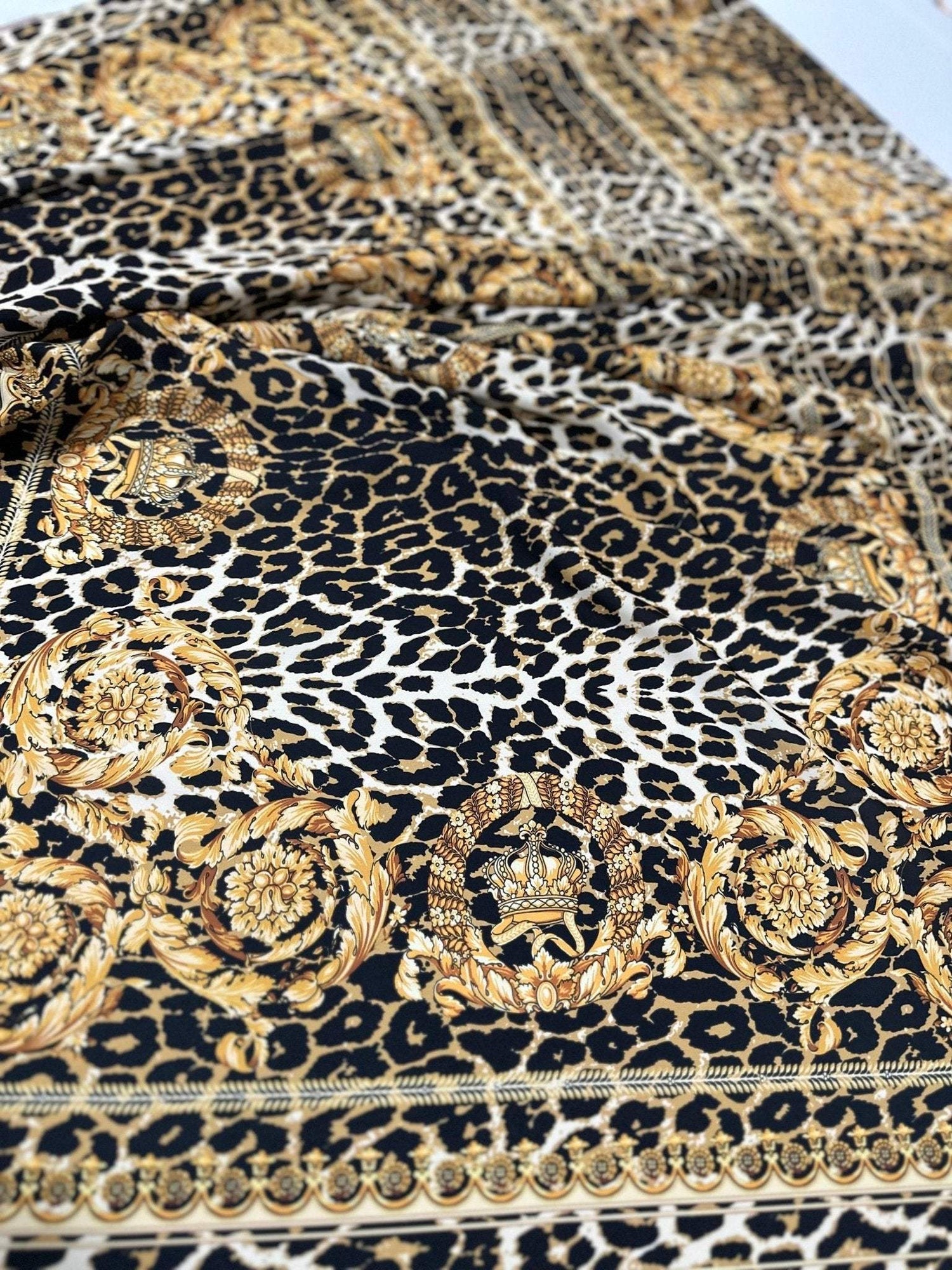 Leopard gold baroque patterned crepe fabric with elegant animal print and ornate gold designs, 150cm width