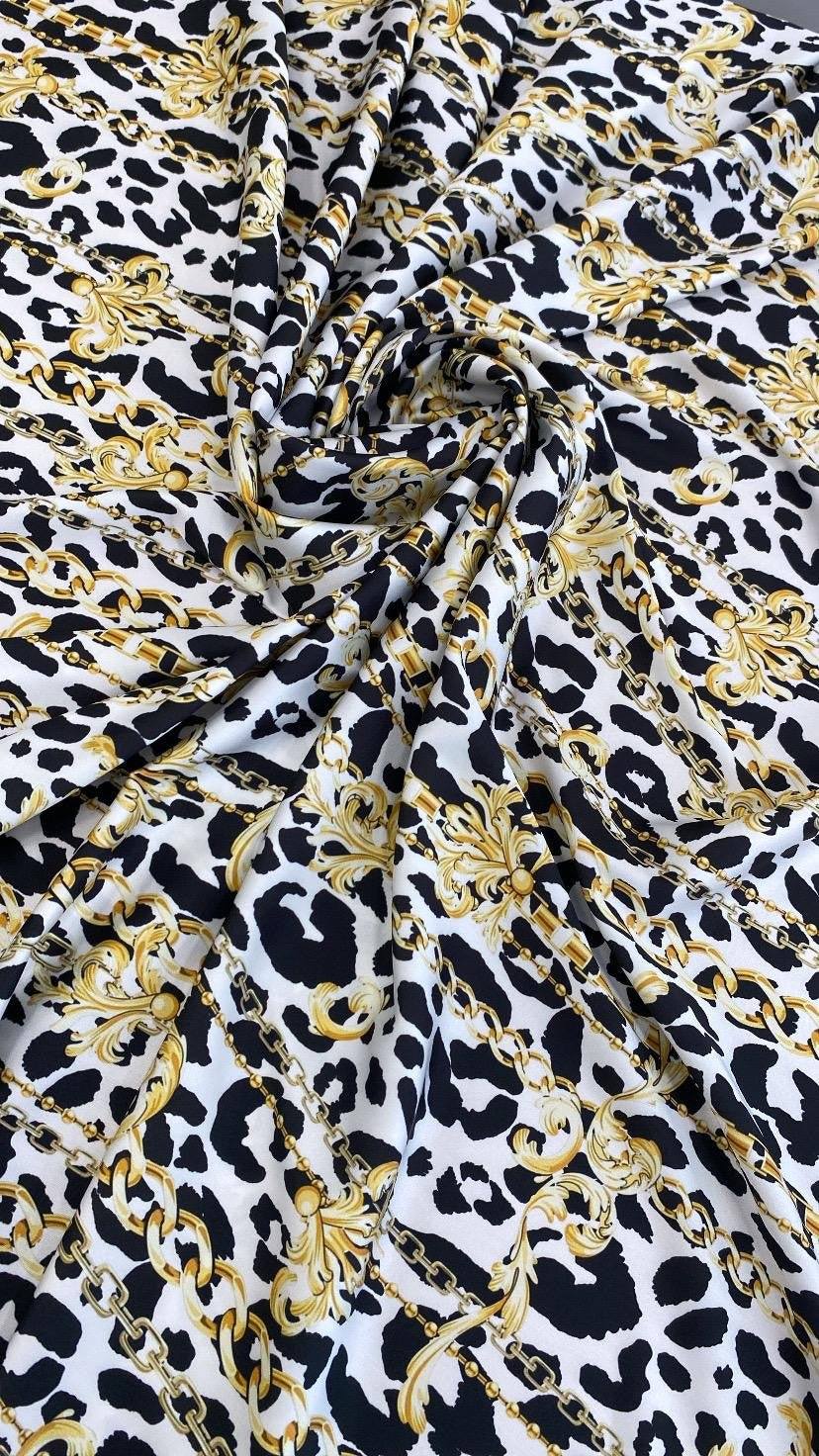 Luxury Baroque Chain fabric with black and white leopard print and gold ornamental details