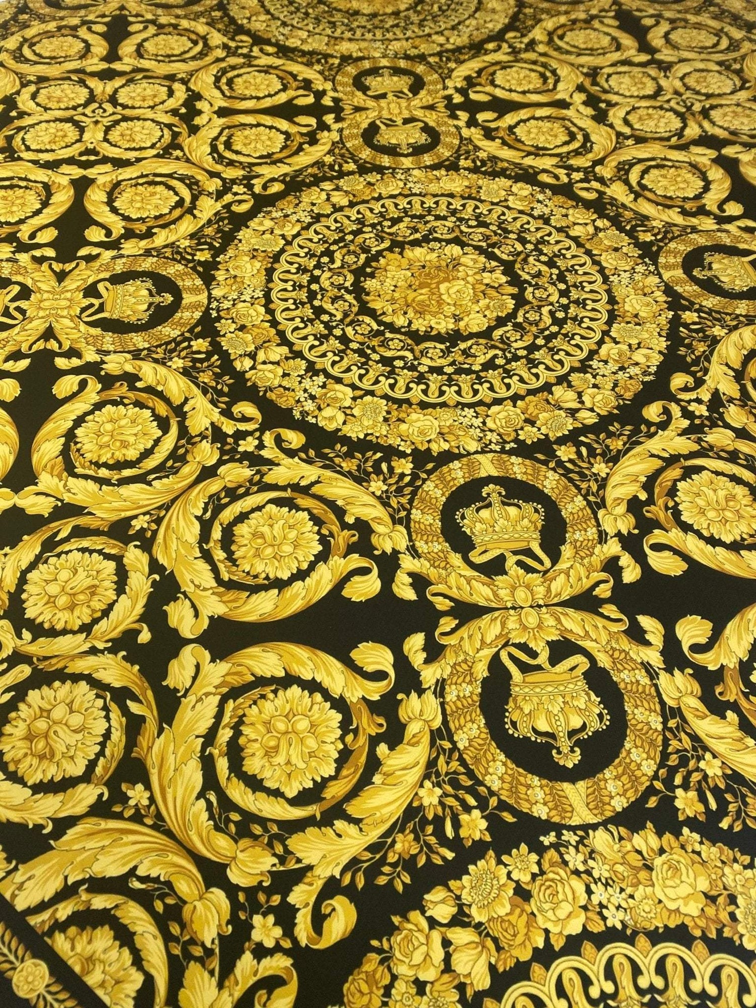 Luxury Baroque gold pattern fabric with intricate designs on black background for upholstery and fashion