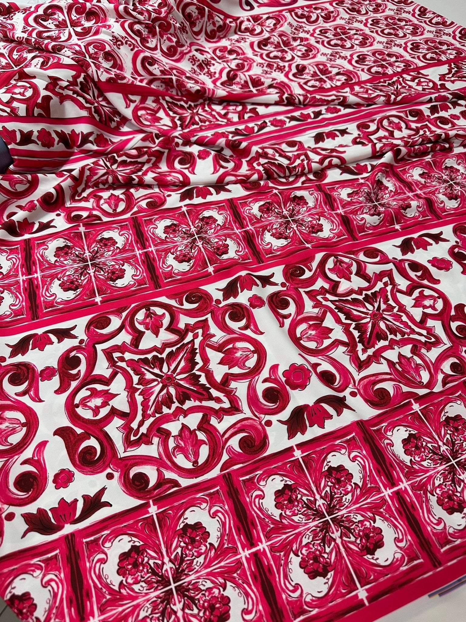 Pink Sicilian Majolica pattern fabric with intricate floral and geometric designs on white background