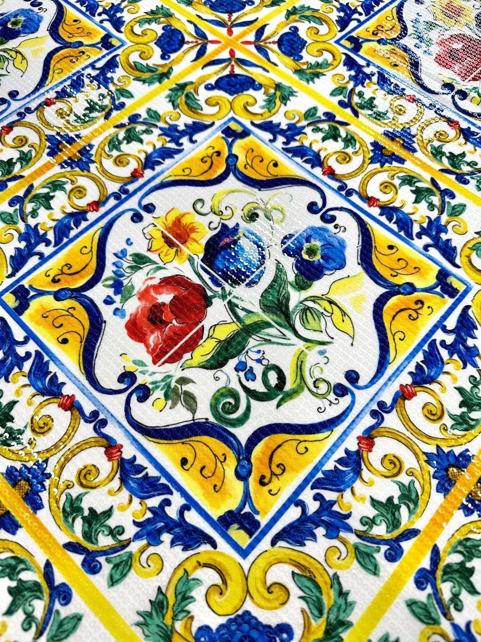 Majolica pattern sequin fabric with vibrant floral and geometric designs in yellow, blue, red, and green, featuring shimmering sequins and two-way stretch.