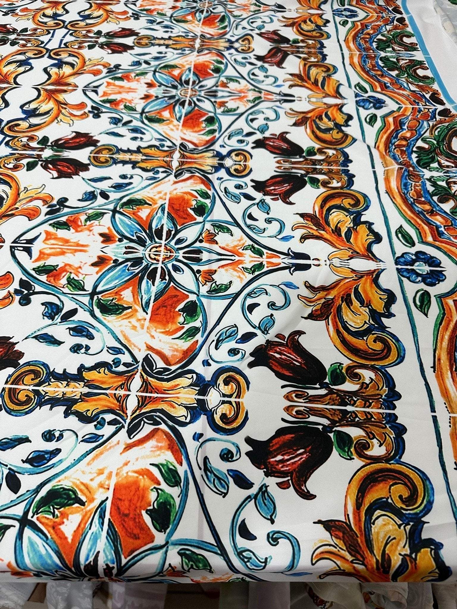 Majolica Pattern Fabric with colorful intricate floral and geometric designs on a white background for upholstery and curtains