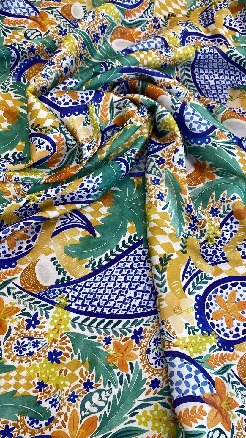 Mediterranean tile print fabric with vibrant blue, green, yellow, and orange patterns, soft and durable textile for home décor and crafts