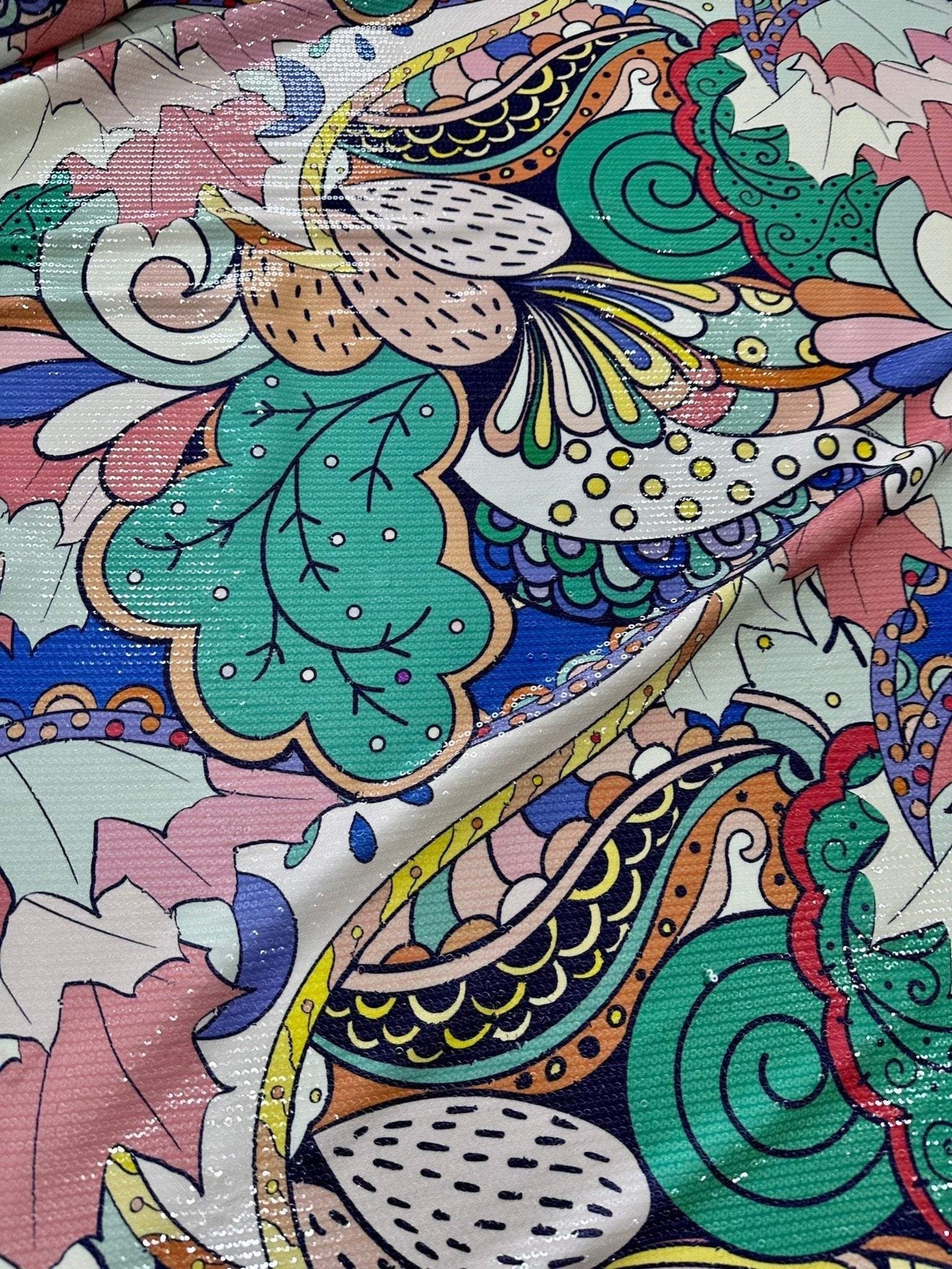 Close-up of colorful Mehndi Flowers Sequin Fabric with intricate floral and paisley patterns and 2-way stretch texture