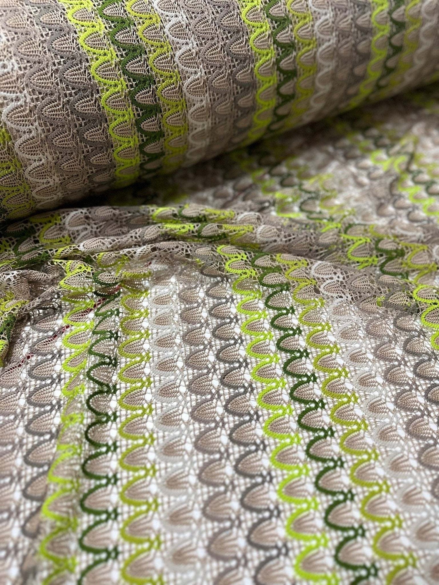 Beige green zigzag knit jersey mesh fabric with soft stretchy texture for clothing and crafts