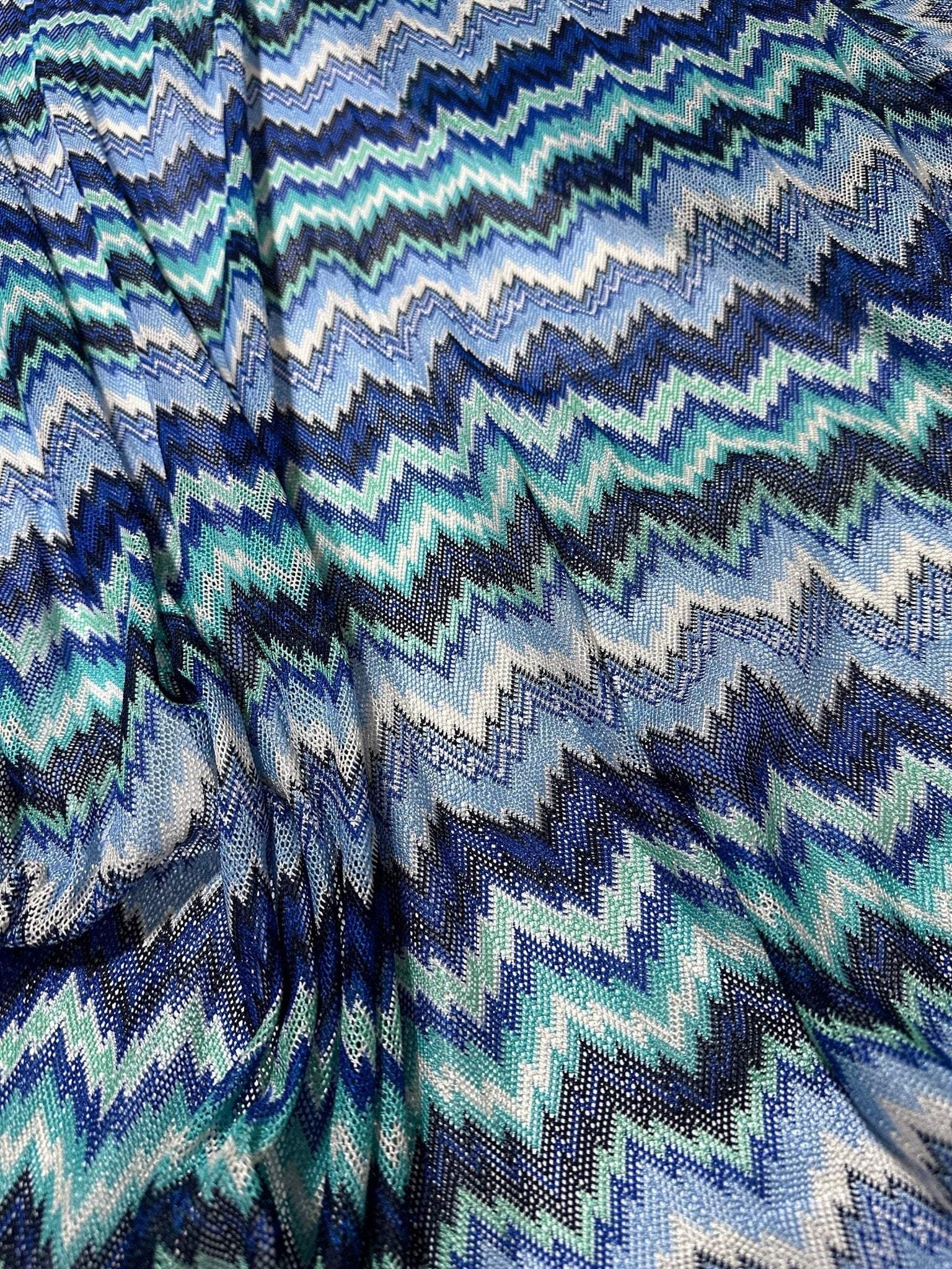 Blue and white zigzag knitted mesh fabric with chevron pattern for versatile sewing projects