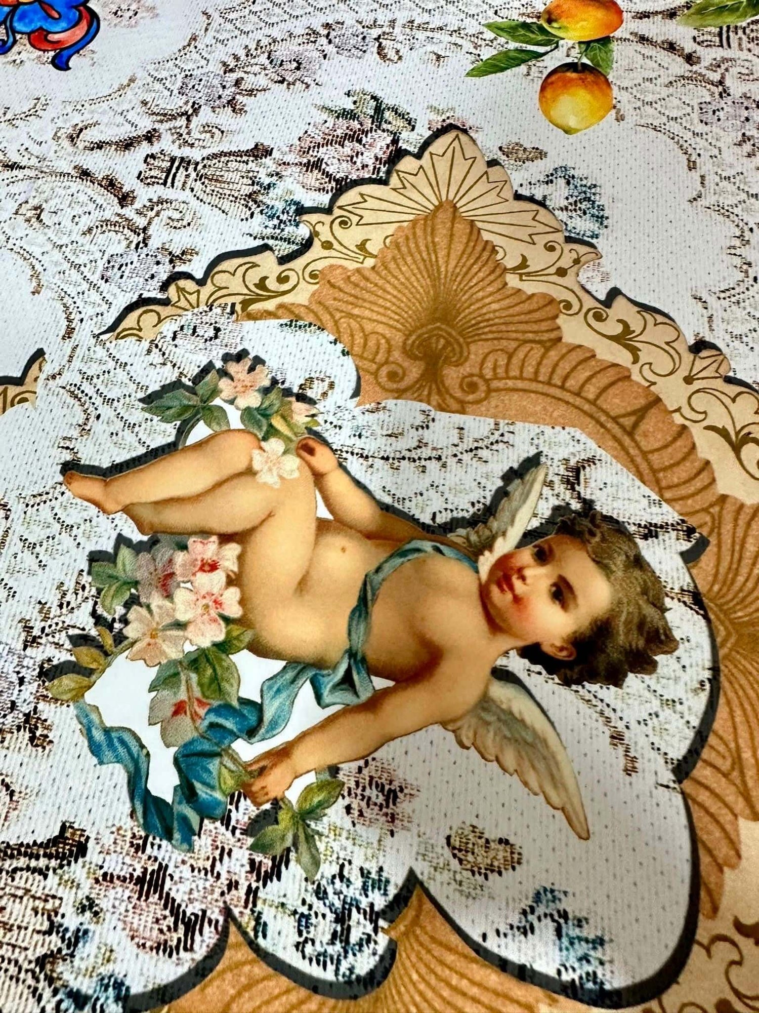 Close-up of Floral Mosaic Lemon Angel Pattern Fabric featuring cherub, floral elements, and lemon motifs on textured fabric