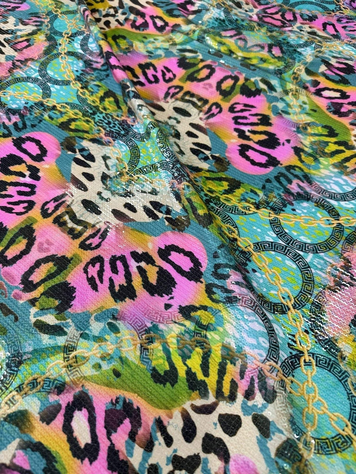 Multicolor leopard pattern sequin fabric with 2-way stretch for elegant evening wear designs