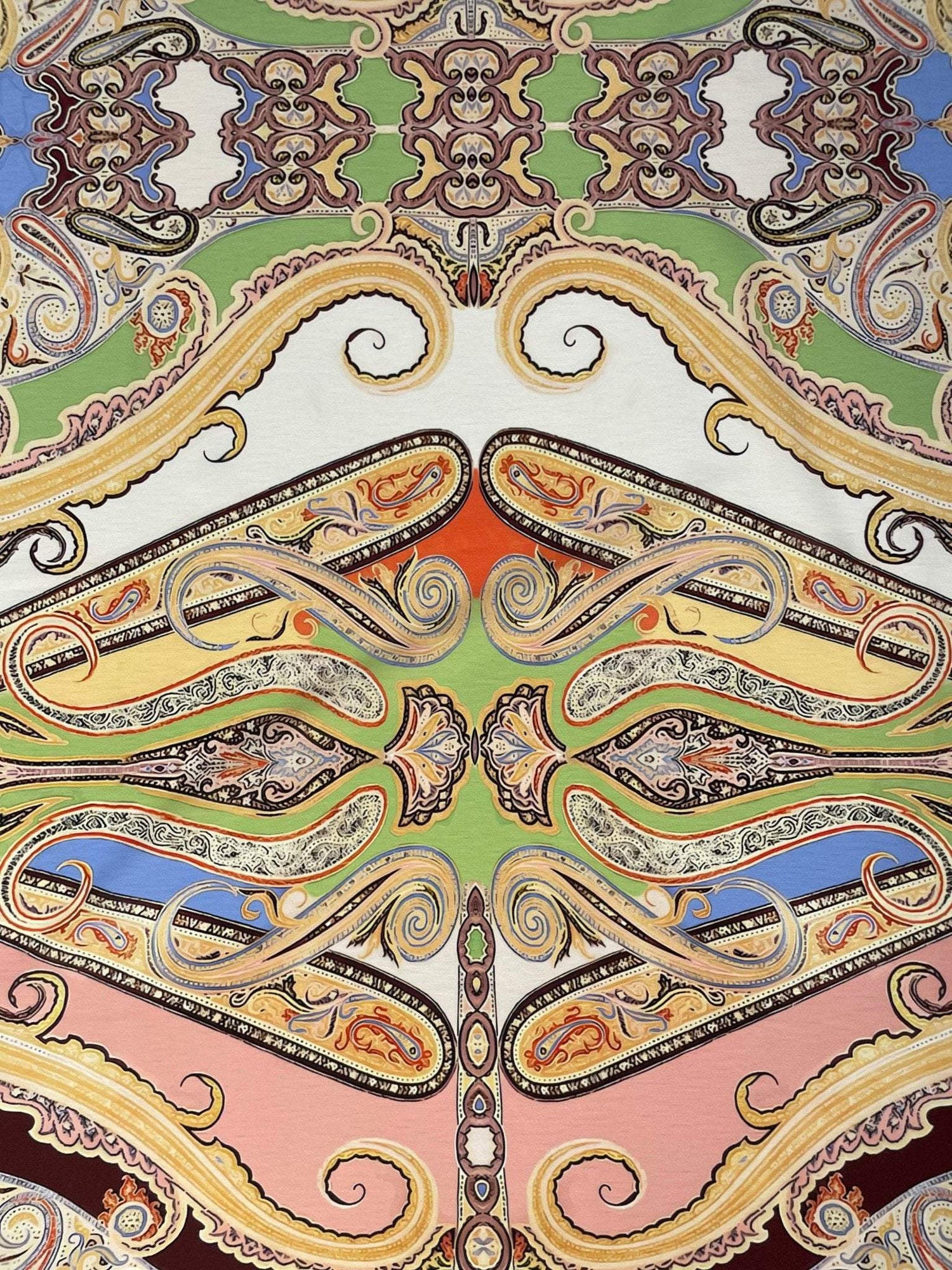 Multicolor vintage bohemian textile with ornate paisley and Baroque-inspired patterns in green, blue, pink, and gold tones