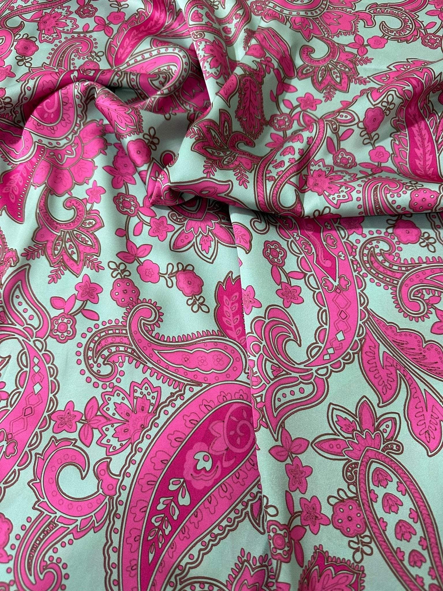 Pink and mint green paisley pattern fabric with intricate floral design and 150cm width