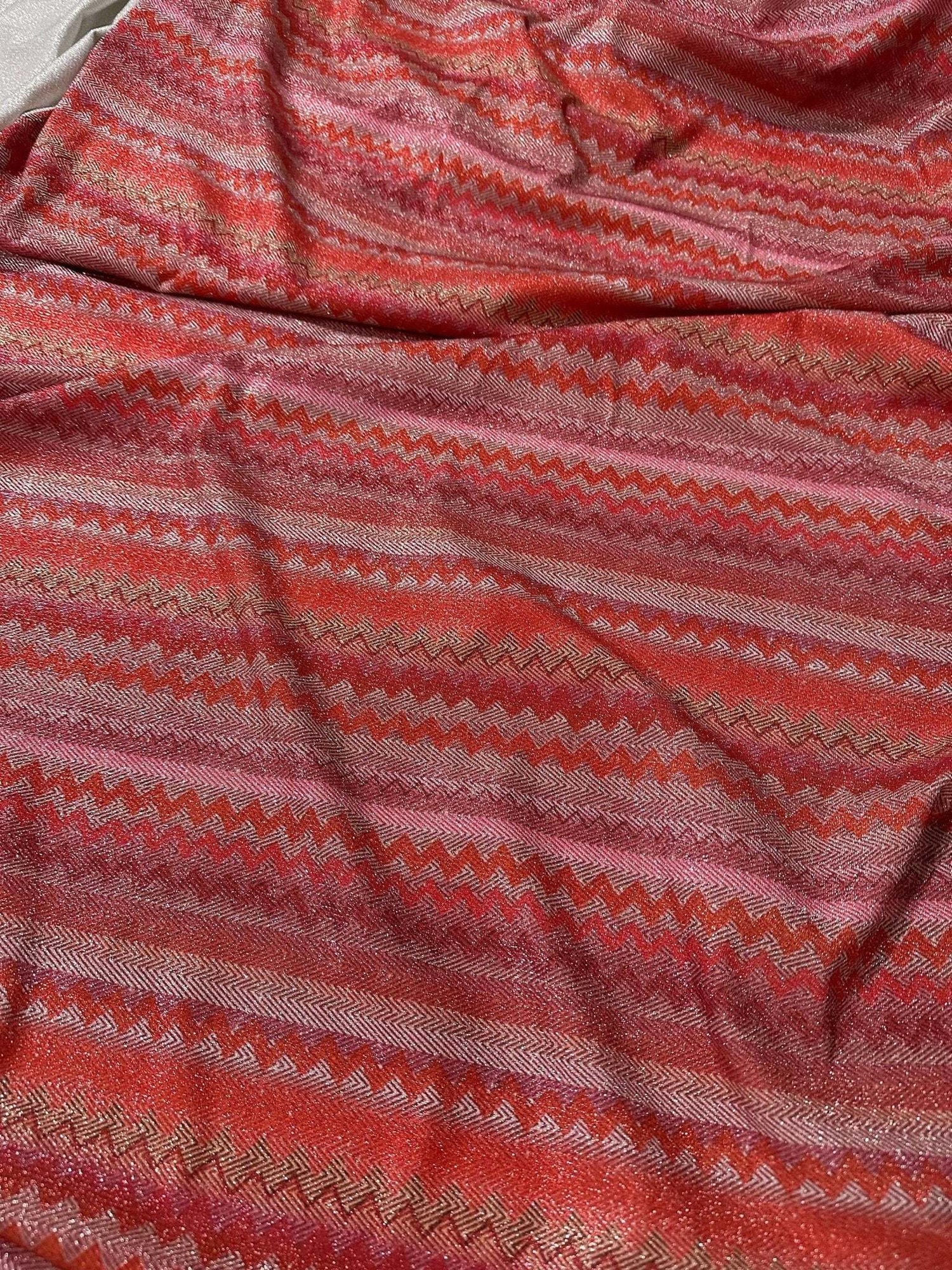 4-way stretch pink and red zigzag knit fabric with Lurex shimmer accents
