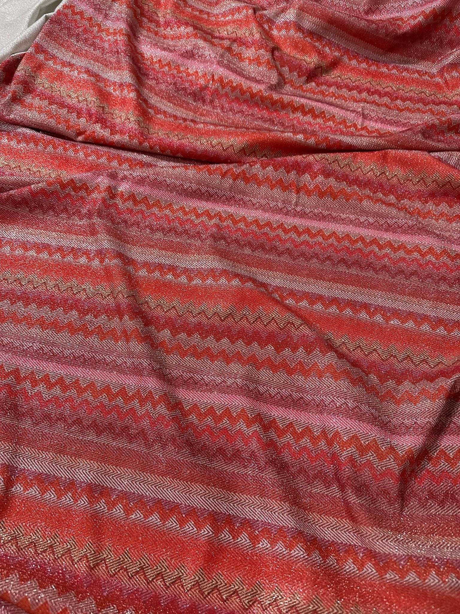 4-way stretch pink and red zigzag knit fabric with Lurex shimmer accents
