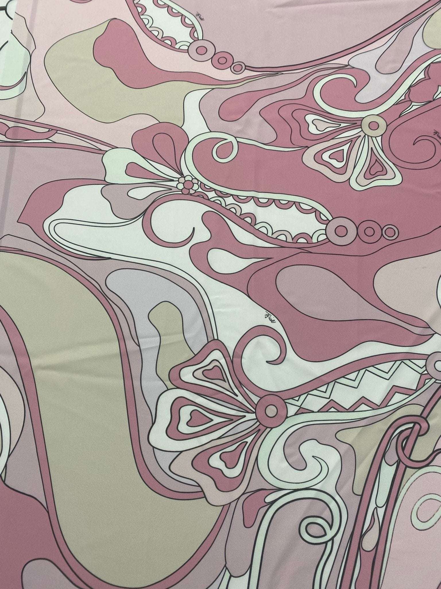 Retro pink abstract floral fabric with swirling vintage-style patterns and soft muted tones