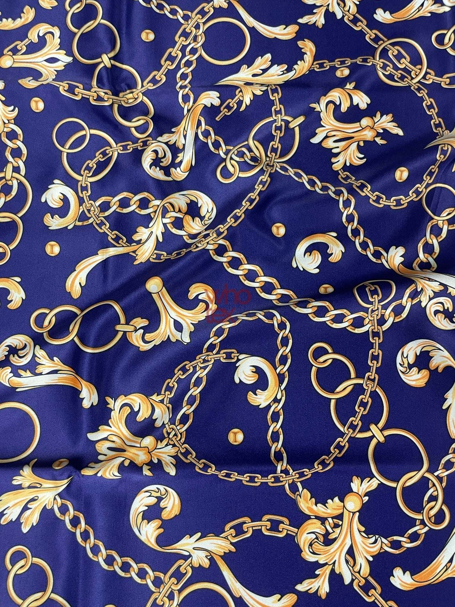royal blue fabric with gold chains and baroque scroll patterns