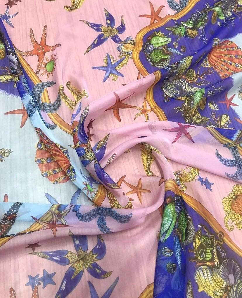 Sea shell pattern chiffon fabric in sugar pink with starfish and marine motifs