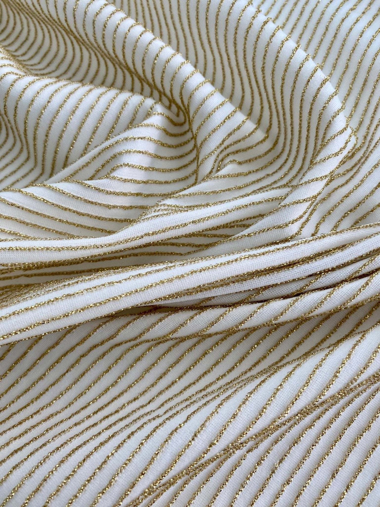 Soft gold striped shimmer ottoman stretch fabric with white jersey spandex texture