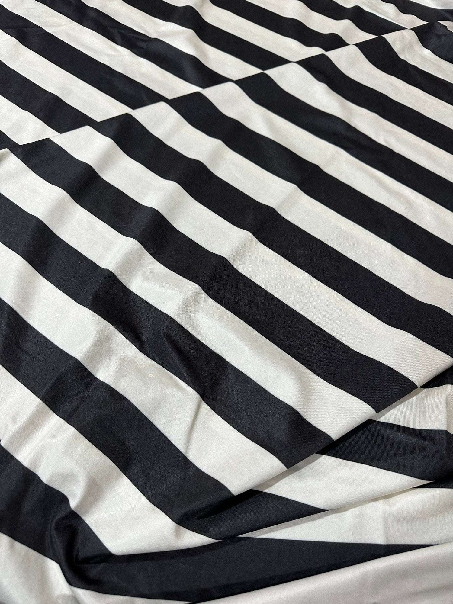 Black and off-white striped fabric with soft, durable texture and 150cm width for sewing and crafting projects
