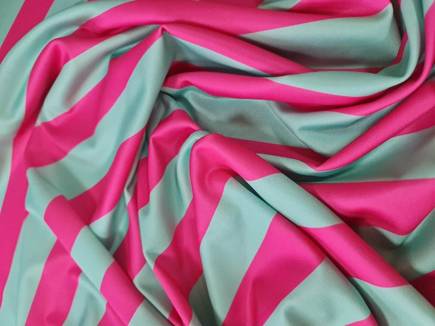 Mint green and pink striped fabric with soft texture and 150cm width for sewing and crafting projects
