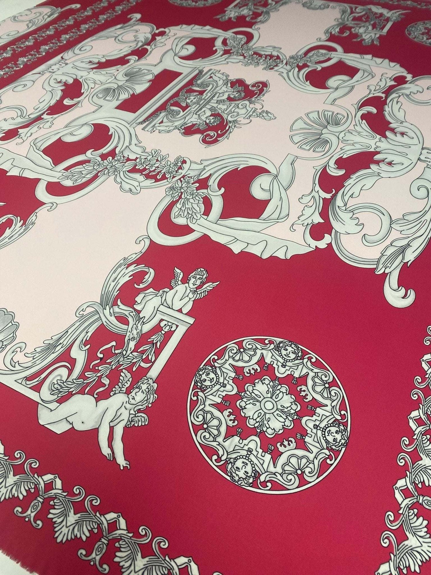 Pink vintage baroque cherub pattern fabric with intricate ornate designs