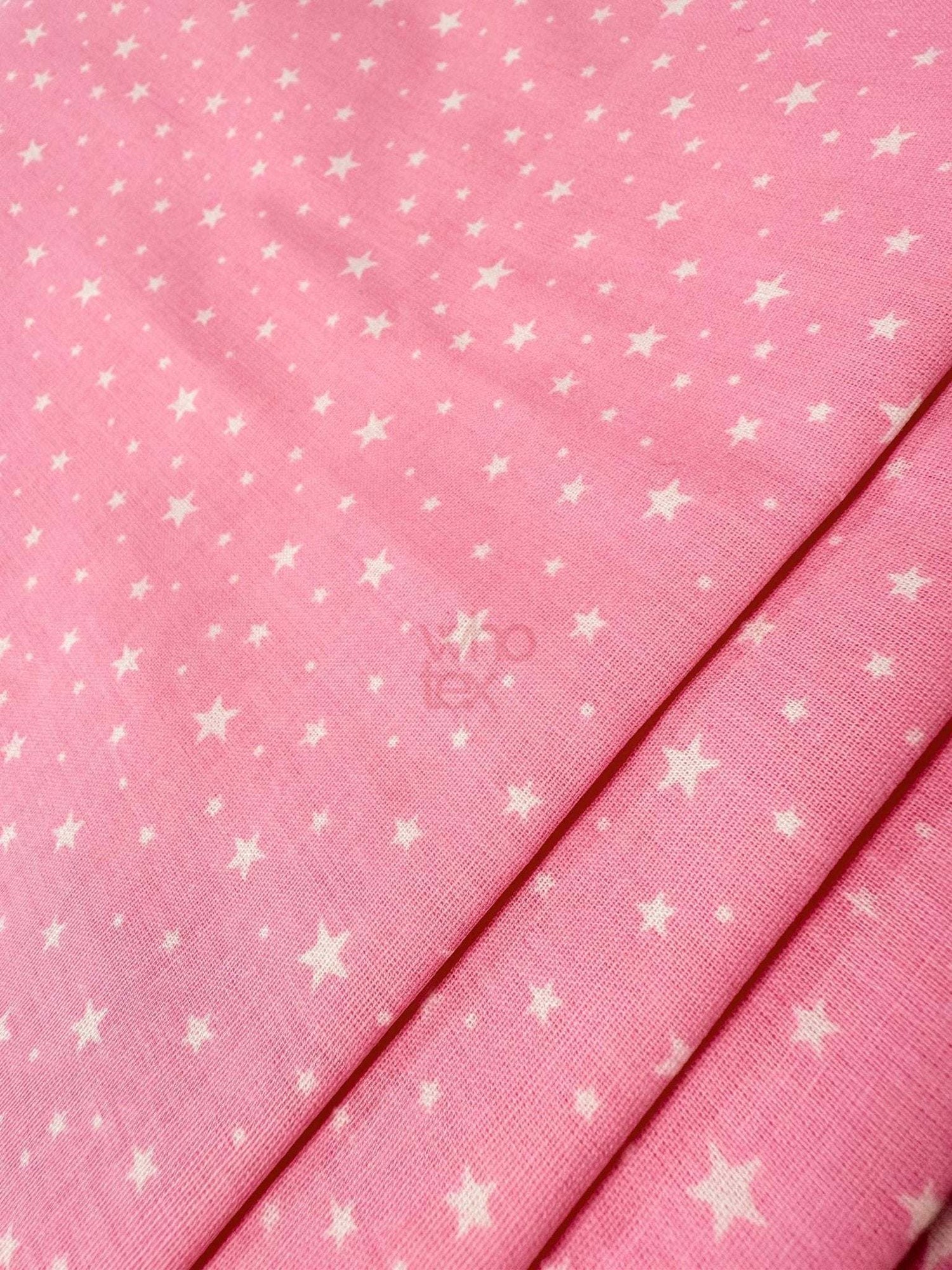 White Stars Pink Poplin cotton fabric with white star pattern on pink background, 170 cm wide, suitable for clothing and home decor.