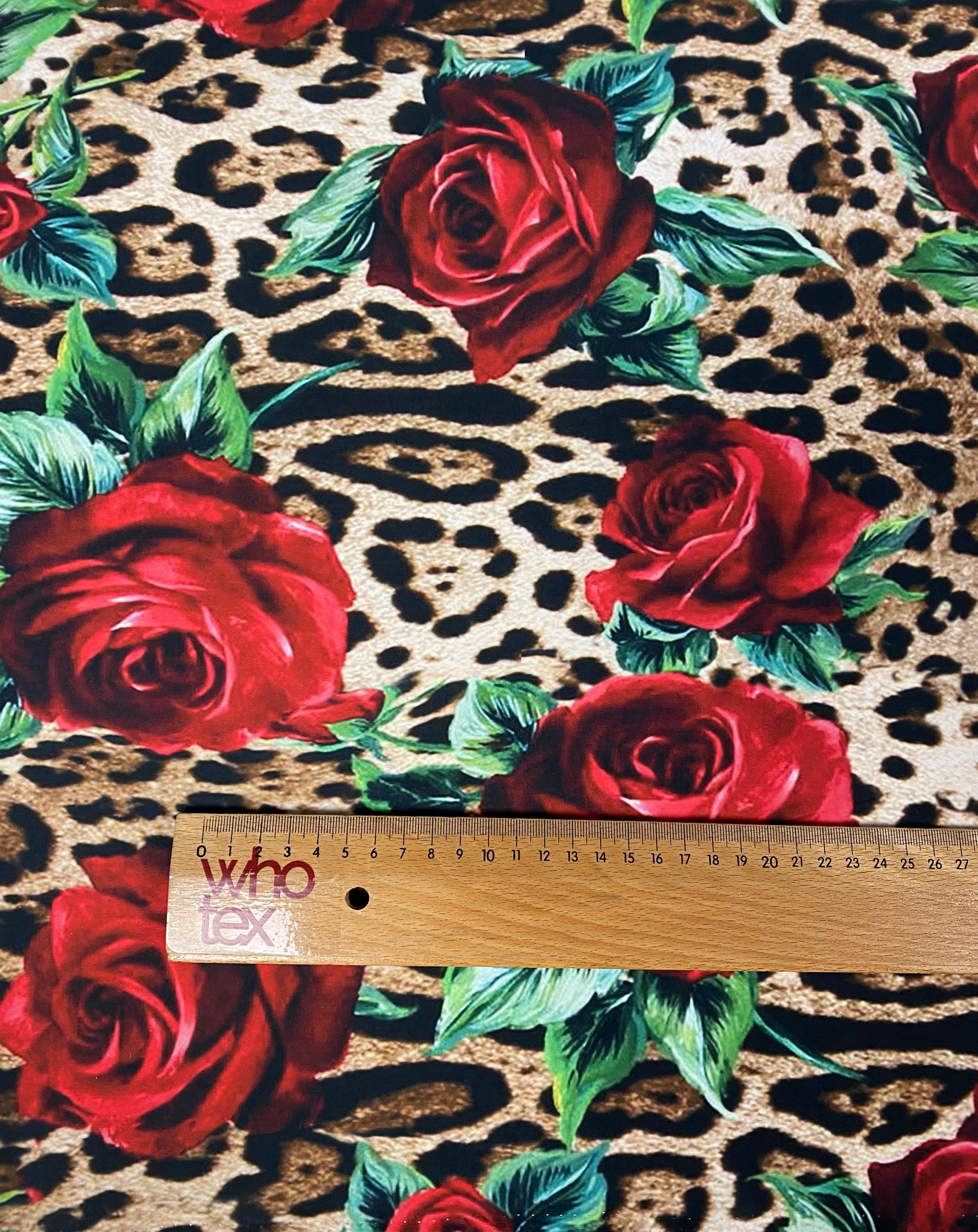 Leopard & Red Rose Crepe Fabric by the Metre – Bold Print featuring red roses on a leopard print background.
