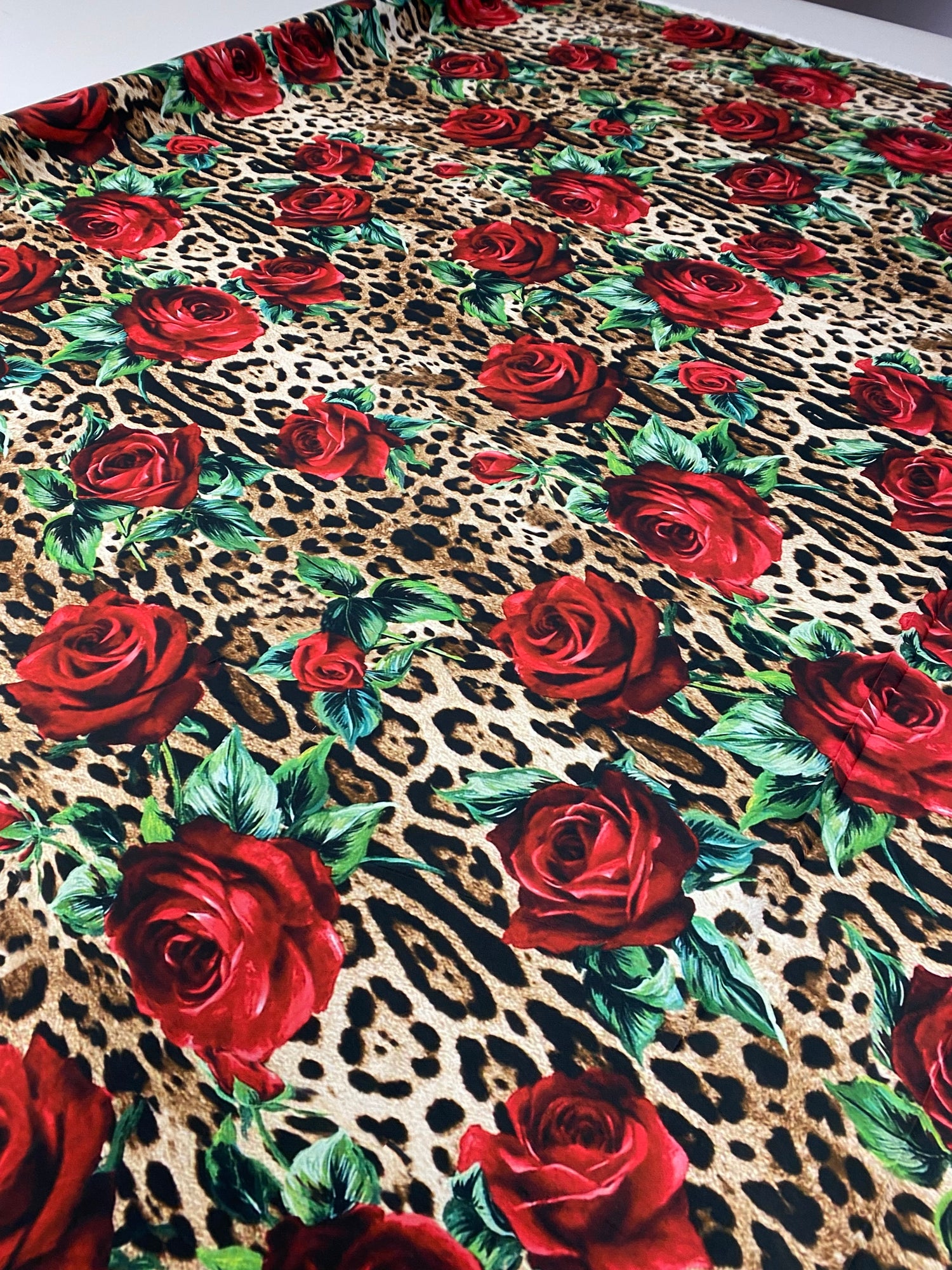 Leopard & Red Rose Crepe Fabric by the Metre – Bold Print featuring striking leopard and red rose patterns.