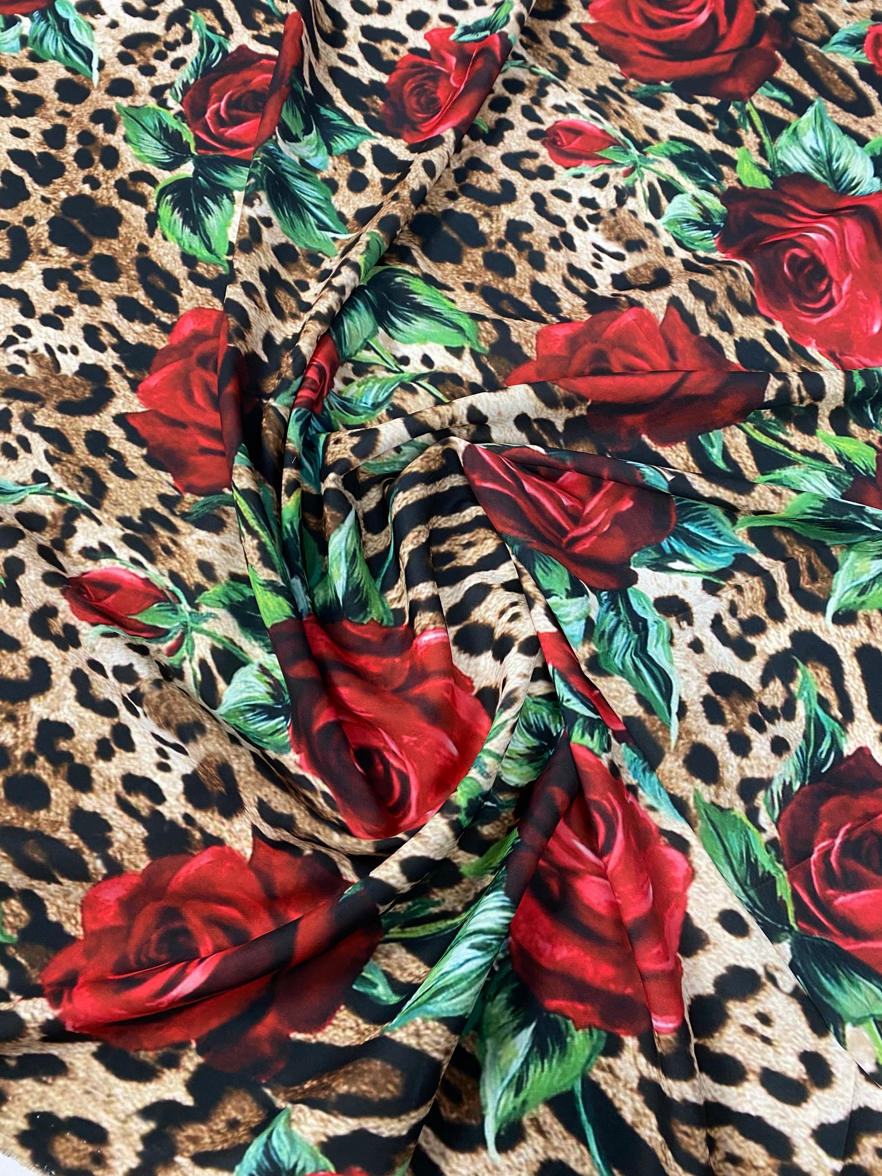 Leopard & Red Rose Crepe Fabric by the Metre – Bold Print showcasing vibrant leopard and red rose pattern.