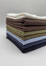 Viscose Linen Fabric by the Metre – Soft Breathable Blend for Dressmaking & Home Décor in various colors stacked neatly.