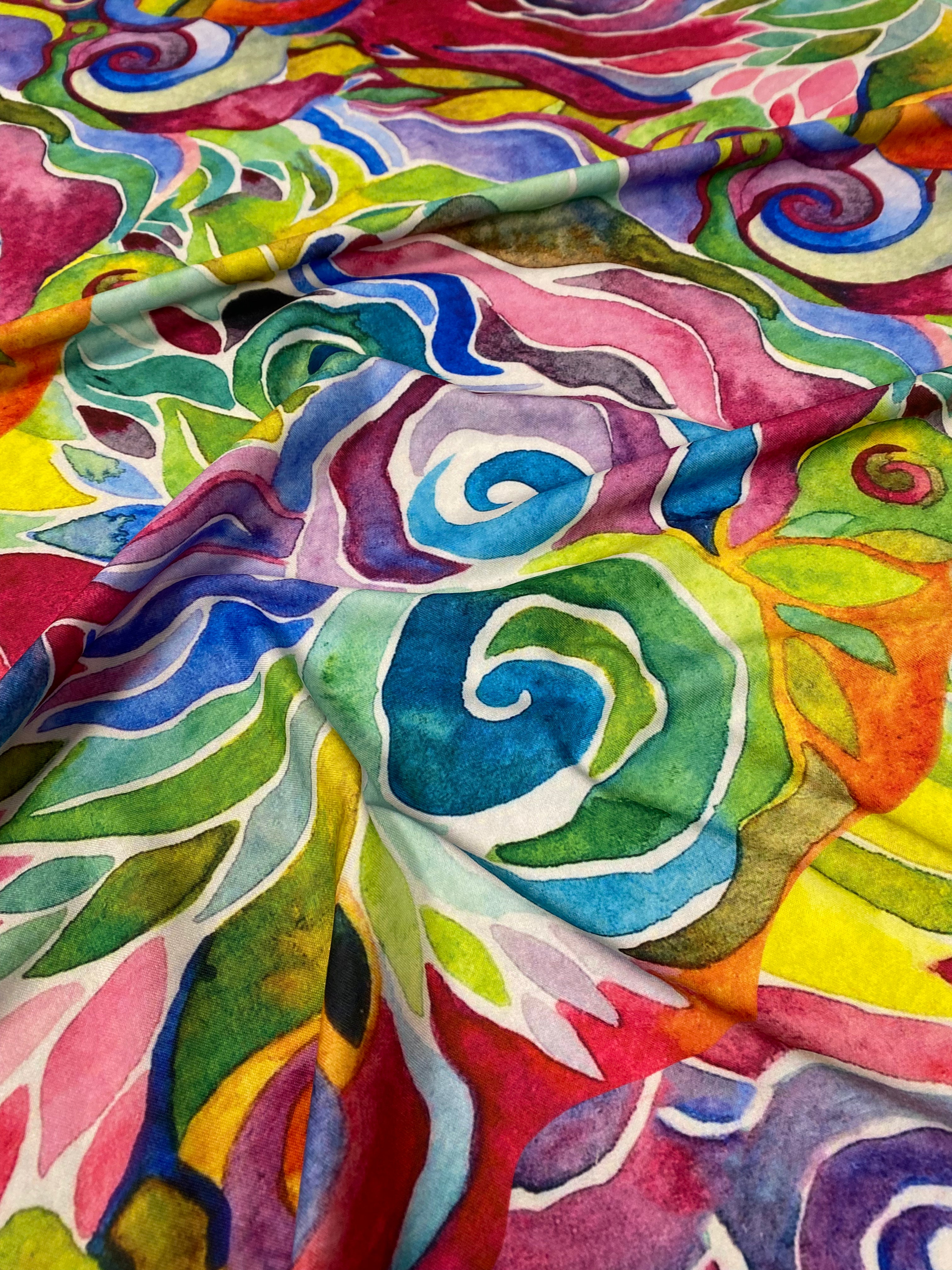 Tejido floral teñido anudado abstracto con patrón vibrante para confeccionar prendas