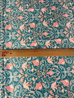 Vintage-inspired floral fabric with bird motifs in teal and pink tones, shown with a measuring ruler for scale