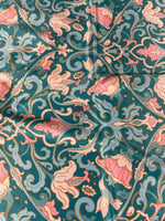 Vintage-inspired floral fabric with pink flowers and birds on teal background